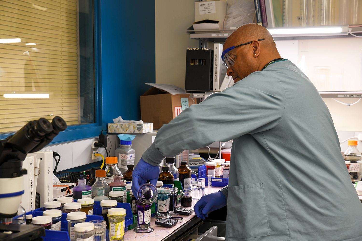 Rodney Barber mixes stains which will be used to identify antibody markers on patient slides.